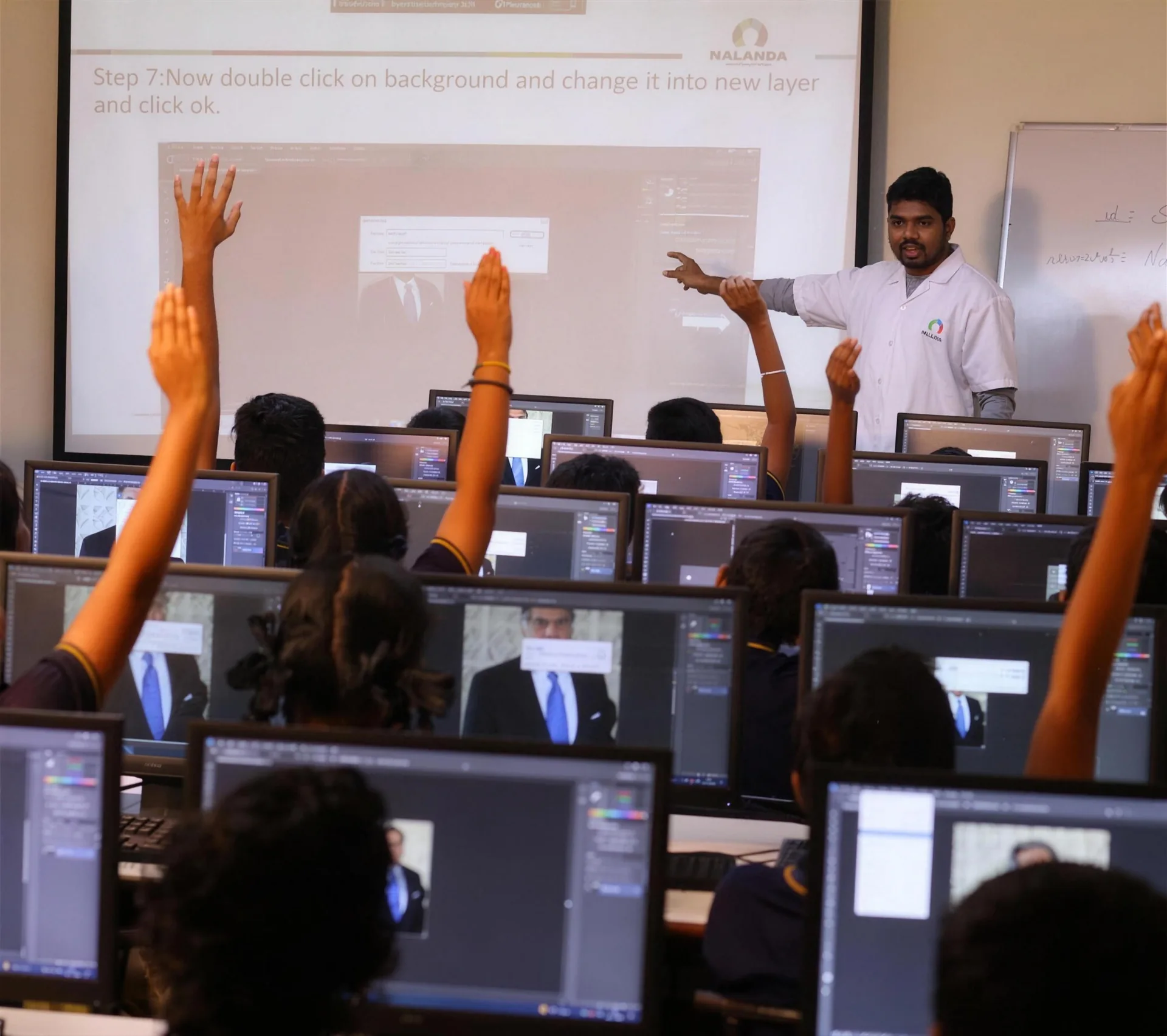 Students working at rows of computers in the campus computer lab